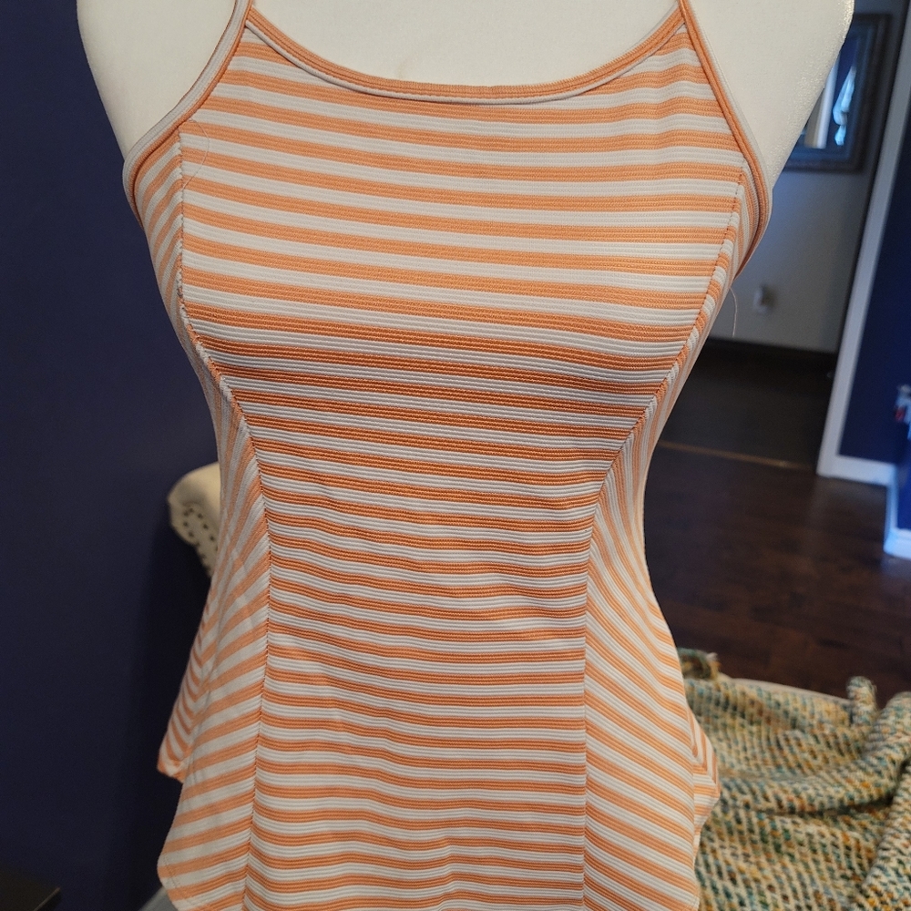 White and orange striped tank